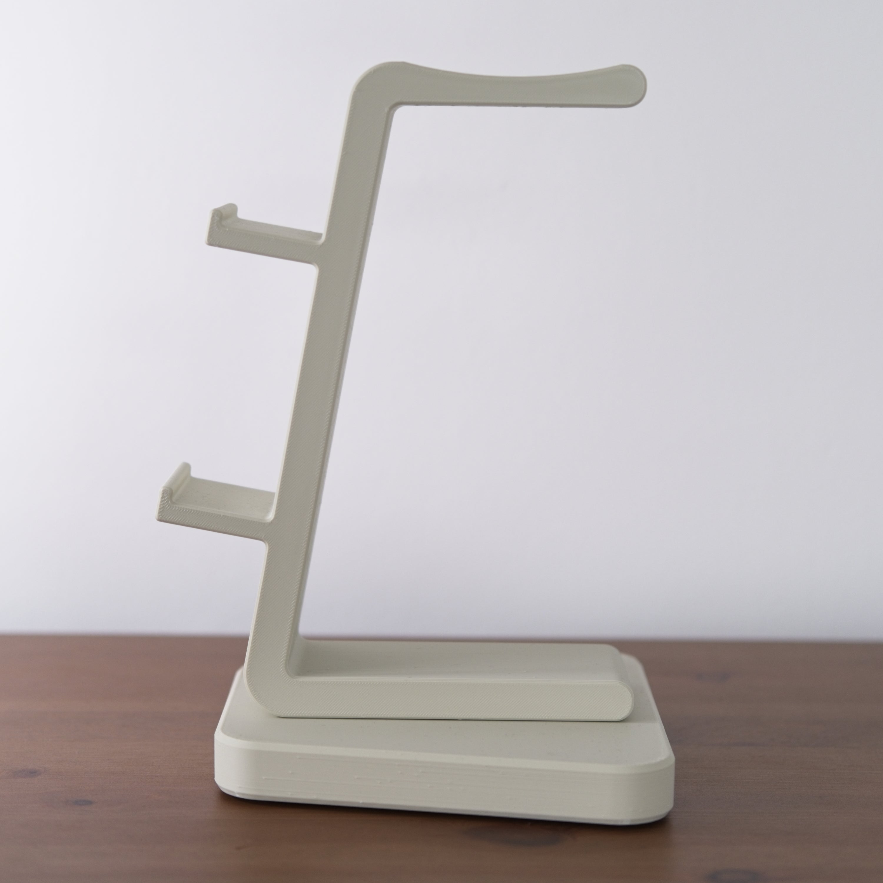 All-in-One Headset and Controller Gaming Stand displayed in a sleek design to hold gaming equipment.