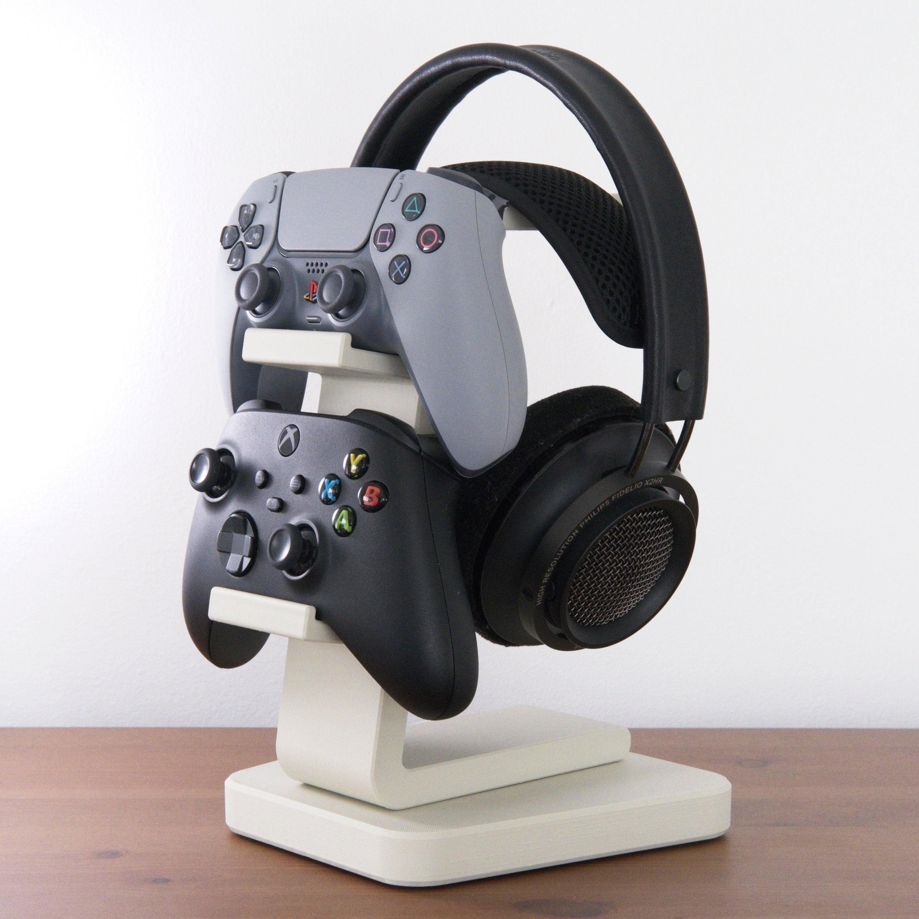 All-in-One Headset and Controller Gaming Stand with headsets and controllers organized neatly.
