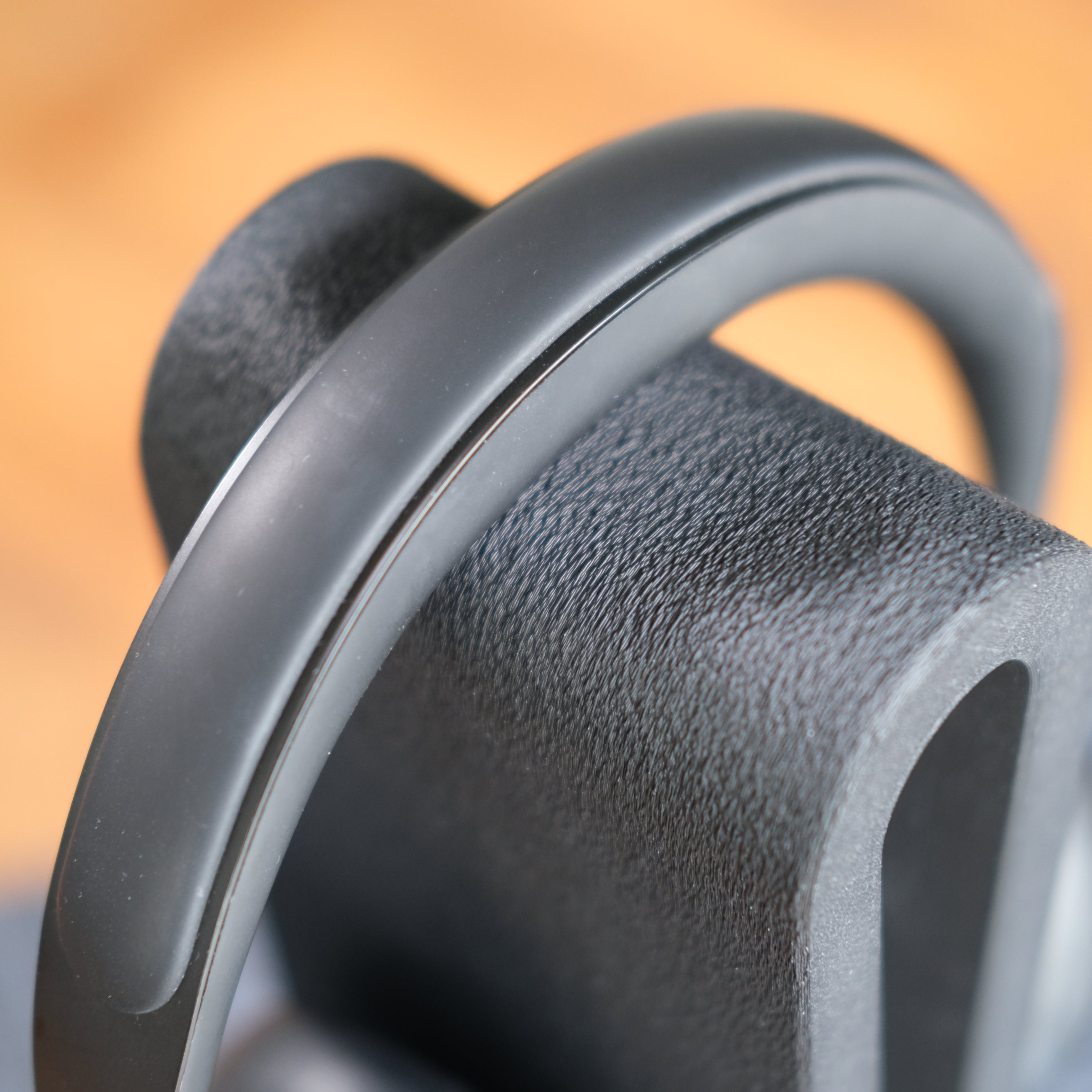 Close-up of a sleek Headphone Display Stand showcasing its modern design and smooth finish.